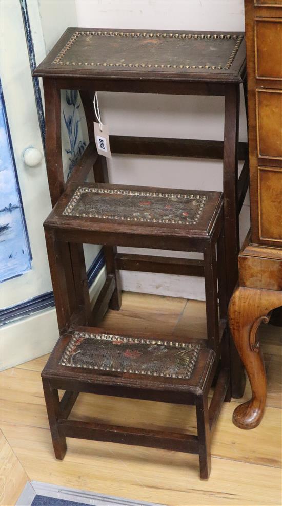 A set of late Victorian mahogany folding library steps with painted leather panels H.70cm